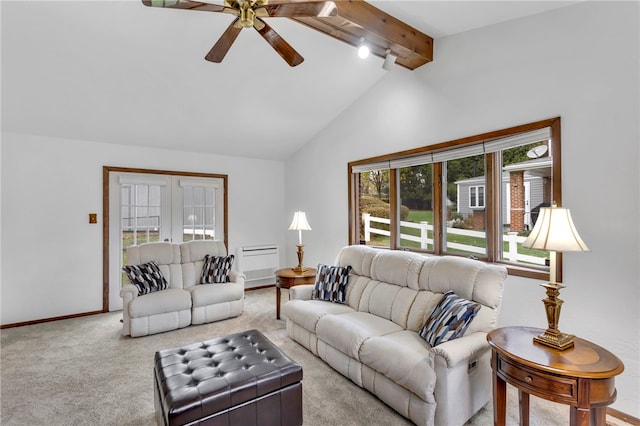 living room featuring beamed ceiling, ceiling fan, light carpet, and high vaulted ceiling