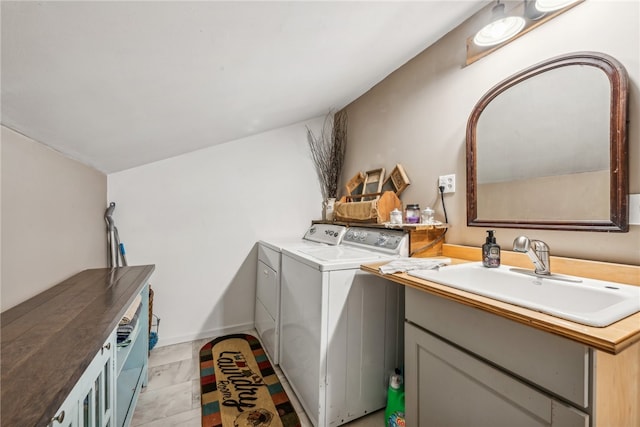 laundry room featuring washer and clothes dryer and sink