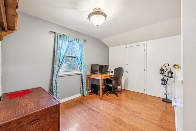 office featuring light hardwood / wood-style floors and vaulted ceiling