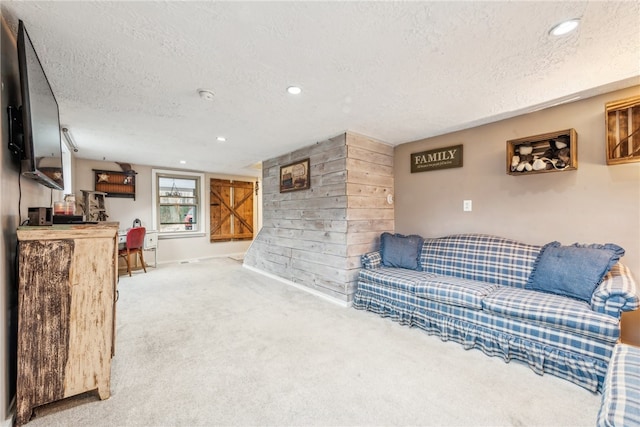 living room featuring a textured ceiling and carpet floors