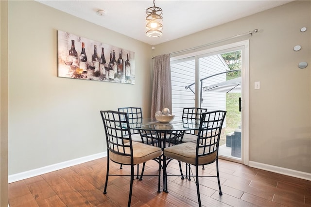 dining room with dark hardwood / wood-style floors