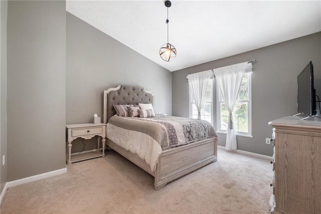 carpeted bedroom featuring vaulted ceiling