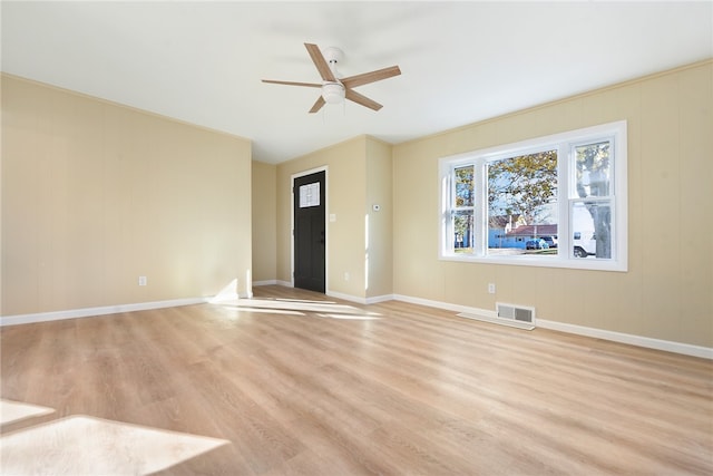 unfurnished room with light wood-type flooring and ceiling fan