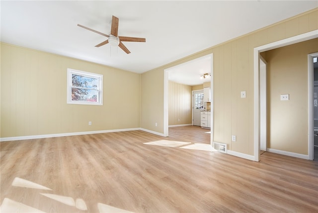 empty room featuring ceiling fan and light wood-type flooring