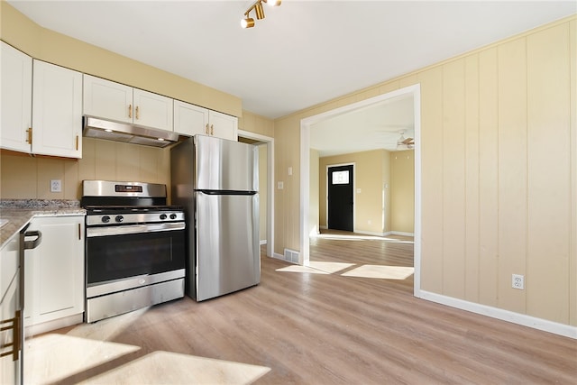 kitchen with stainless steel appliances, light hardwood / wood-style floors, ceiling fan, and white cabinets