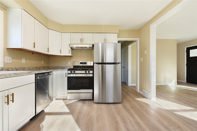 kitchen featuring white cabinetry, appliances with stainless steel finishes, and light hardwood / wood-style floors