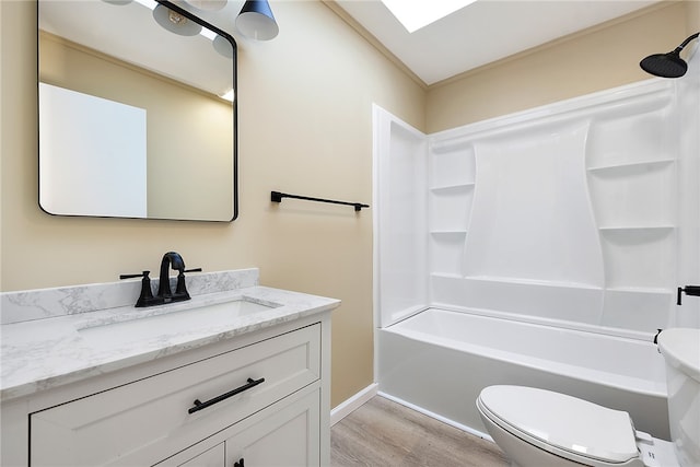 full bathroom with toilet, vanity, wood-type flooring, and shower / washtub combination