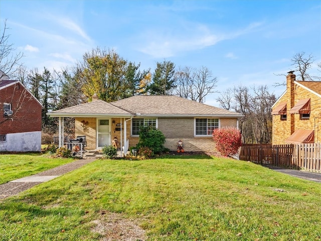 ranch-style home with a front lawn