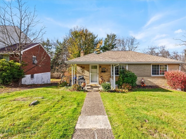 view of front of home with a porch and a front lawn