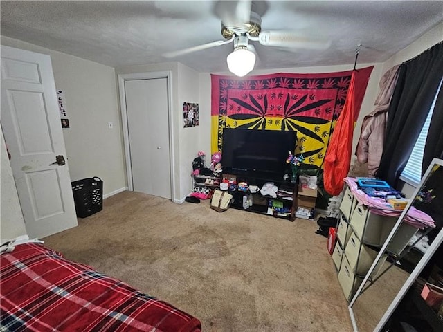 carpeted living room with a textured ceiling and ceiling fan