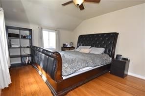 bedroom with lofted ceiling, wood-type flooring, and ceiling fan