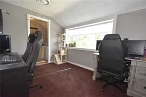 carpeted office space with vaulted ceiling