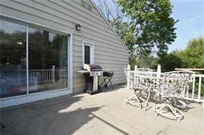 view of patio / terrace featuring a grill and a wooden deck