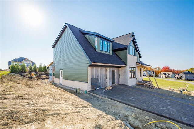 back of property with a patio area