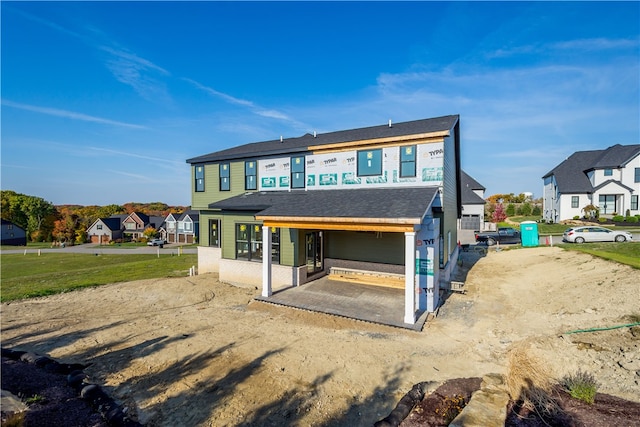 rear view of property featuring a patio