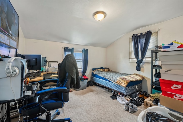 carpeted bedroom with lofted ceiling