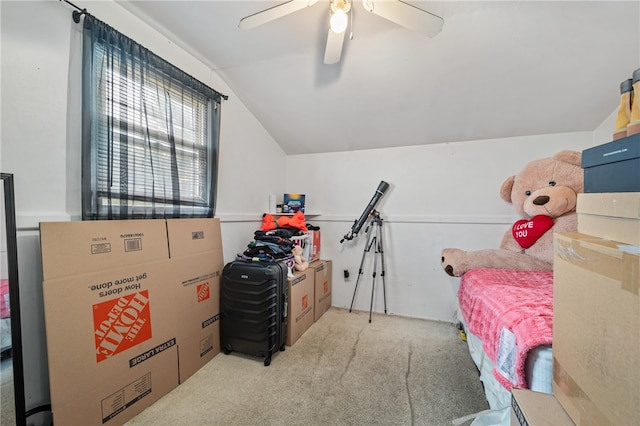 interior space with lofted ceiling, light carpet, and ceiling fan