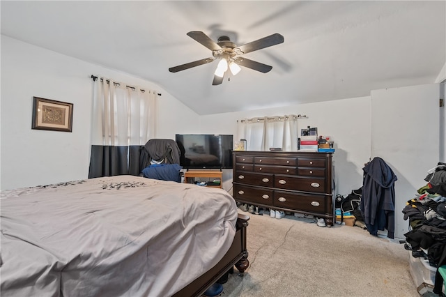 bedroom featuring ceiling fan, lofted ceiling, and light colored carpet