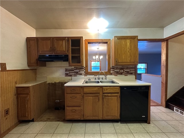 kitchen featuring sink, light tile patterned floors, a healthy amount of sunlight, and black dishwasher