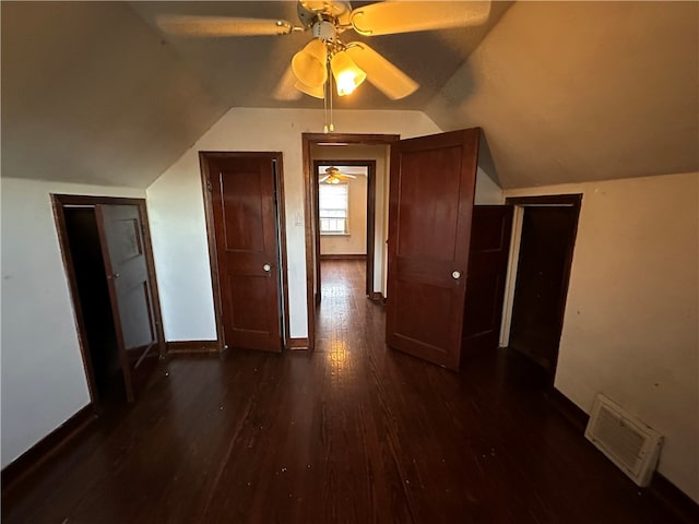 additional living space with vaulted ceiling, ceiling fan, and dark wood-type flooring