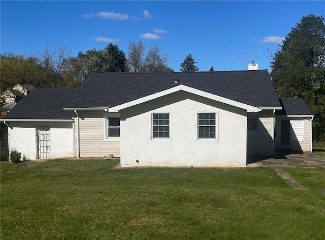 3036 Mcneal Rd, Hampton, PA 15101 - back of property featuring a yard, a shingled roof, and stucco siding