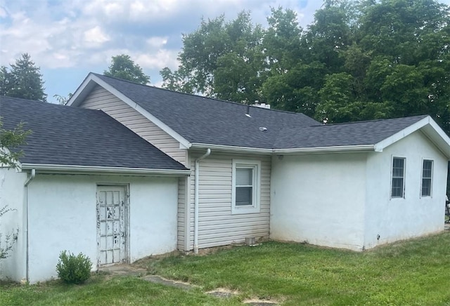 3036 Mcneal Rd, Hampton, PA 15101 - view of property exterior with a shingled roof, stucco siding, and a lawn