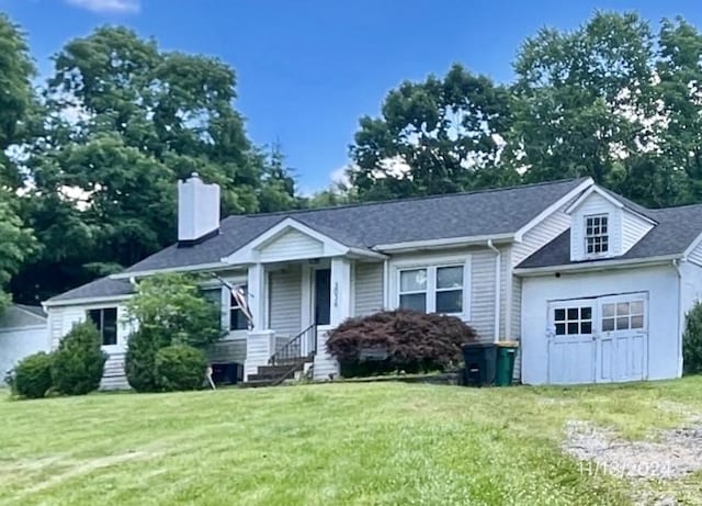 3036 Mcneal Rd, Hampton, PA 15101 - view of front facade featuring a front lawn, a chimney, and a garage