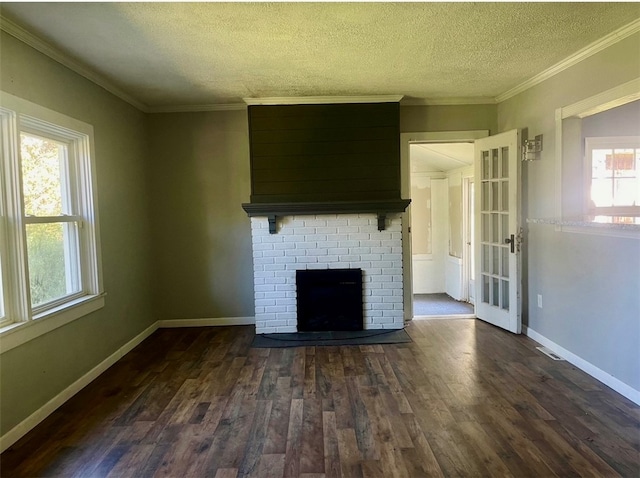 unfurnished living room with plenty of natural light, dark hardwood / wood-style floors, and crown molding