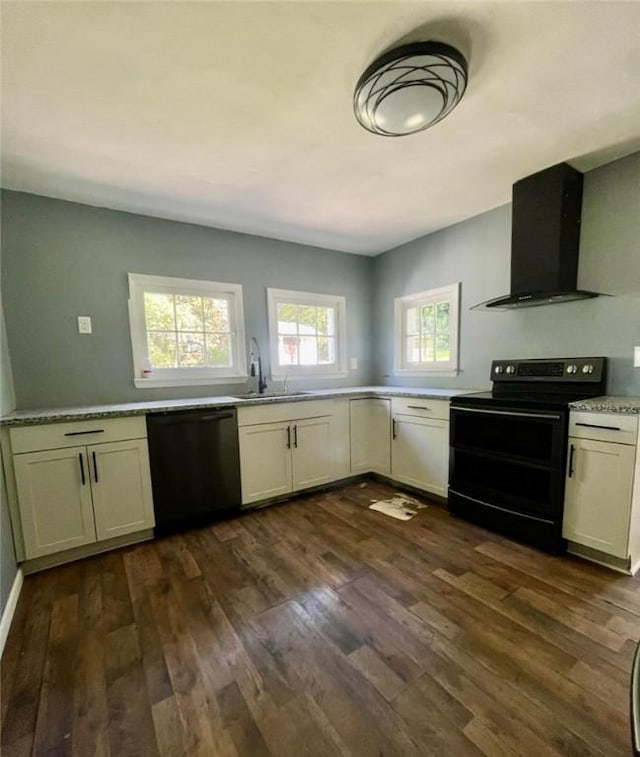 3036 Mcneal Rd, Hampton, PA 15101 - kitchen featuring black appliances, ventilation hood, dark wood-type flooring, and light countertops
