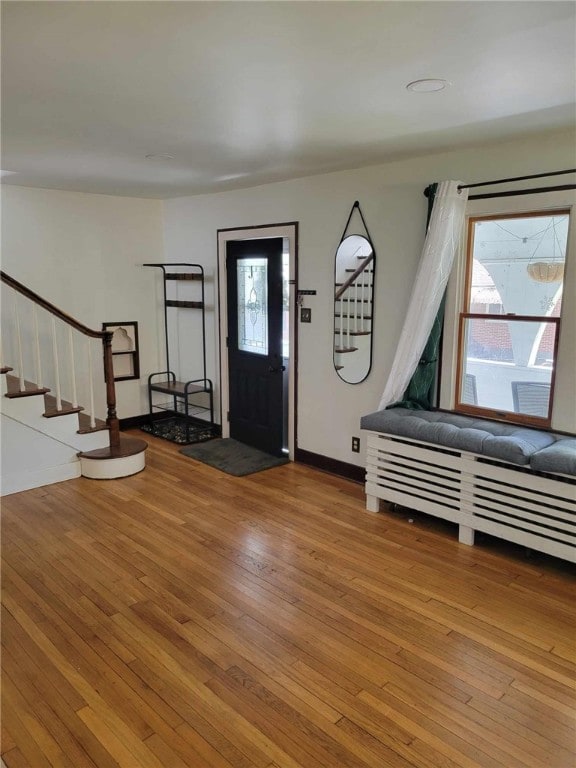 entryway with hardwood / wood-style flooring