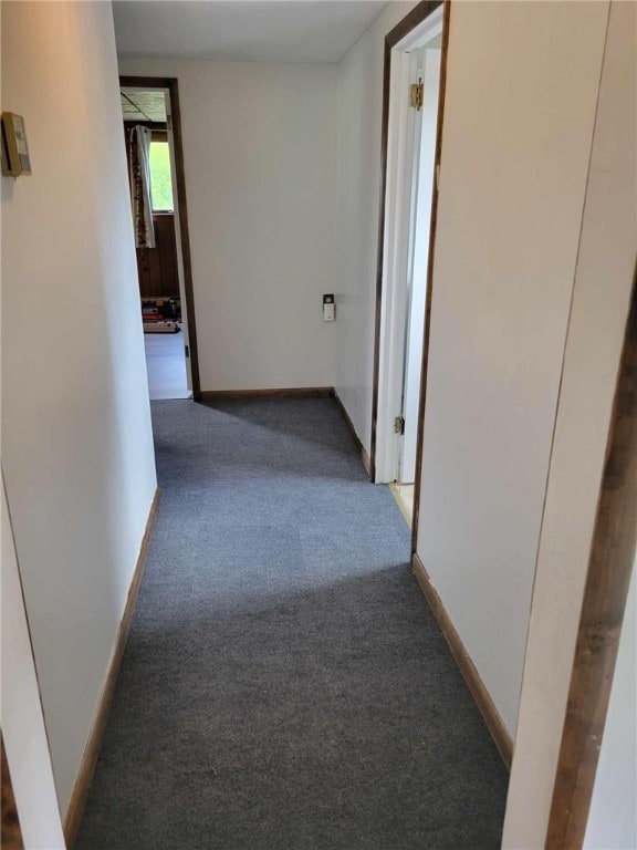 hallway with dark carpet