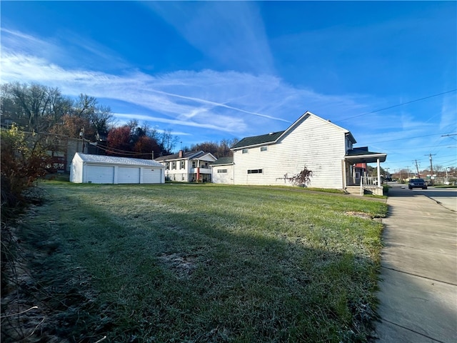 view of yard with an outbuilding