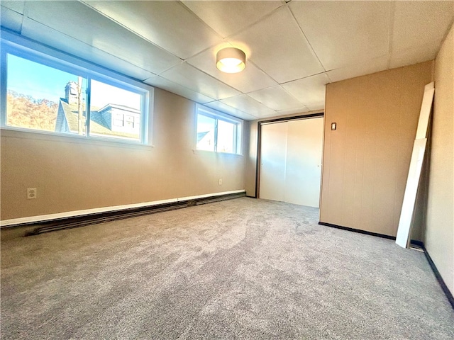 interior space featuring a closet, carpet, and baseboard heating