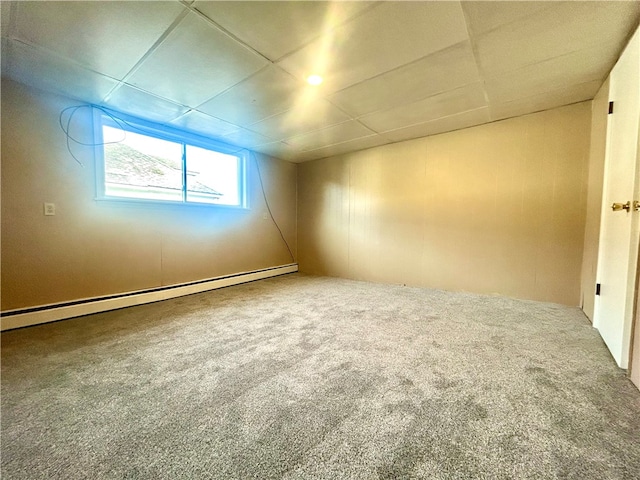 unfurnished room with carpet and a baseboard radiator