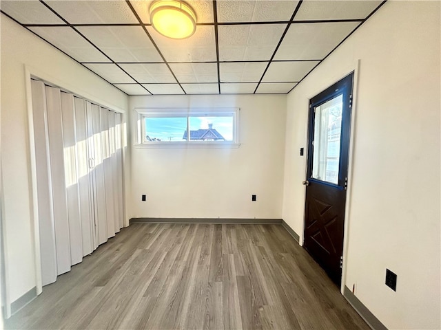 entrance foyer featuring hardwood / wood-style floors and a paneled ceiling