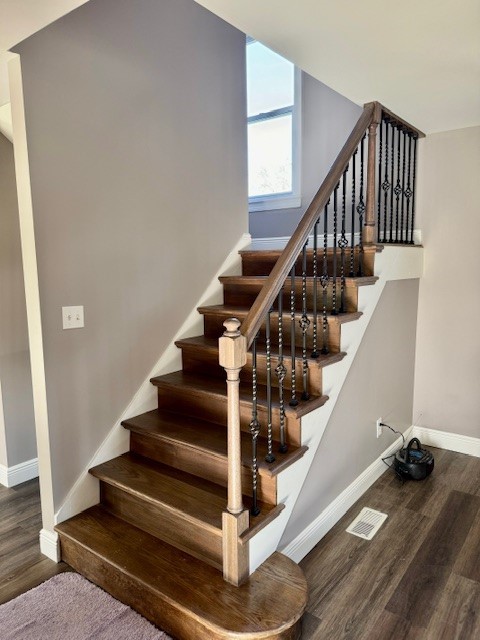 stairway with wood-type flooring