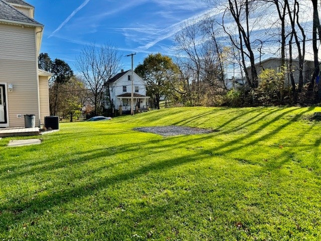 view of yard with central AC