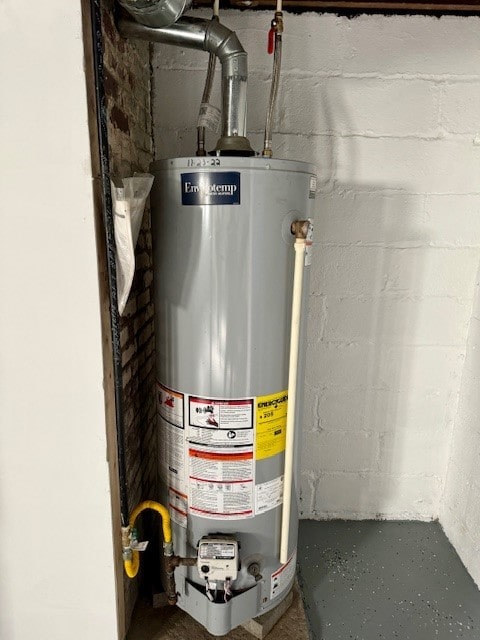 utility room featuring water heater