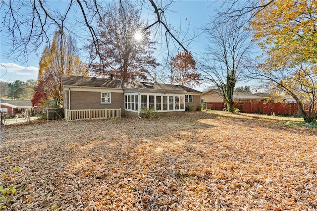 back of house with a sunroom