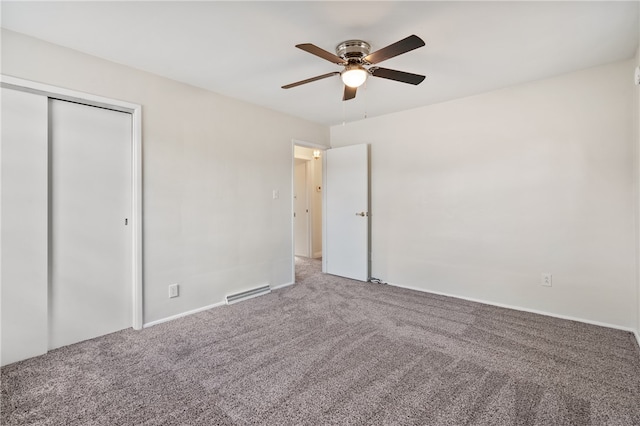 unfurnished bedroom featuring a closet, carpet, and ceiling fan