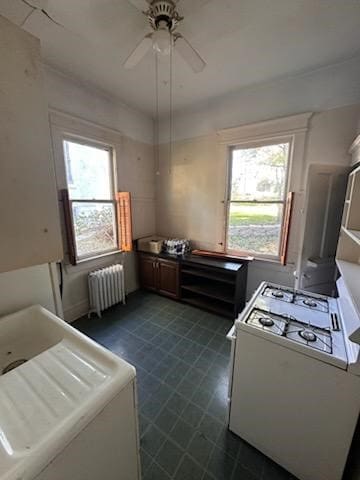 kitchen with ceiling fan and radiator