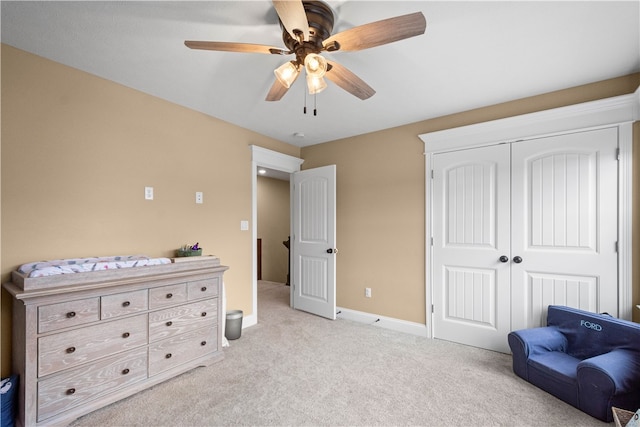 sitting room featuring ceiling fan and light colored carpet