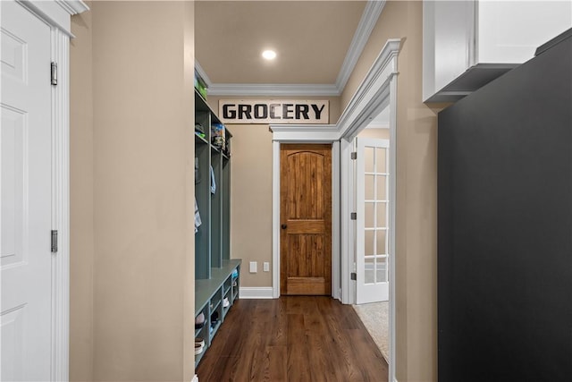 mudroom with crown molding and dark hardwood / wood-style floors