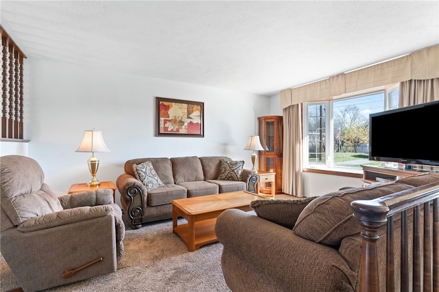 carpeted living room featuring a textured ceiling