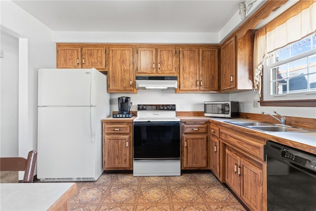 kitchen with white appliances and sink