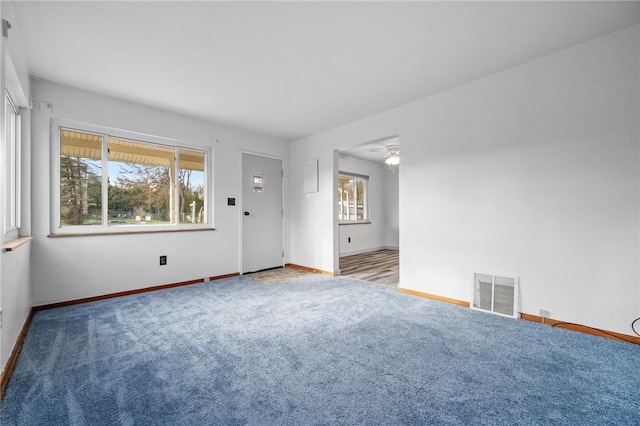 carpeted empty room with ceiling fan