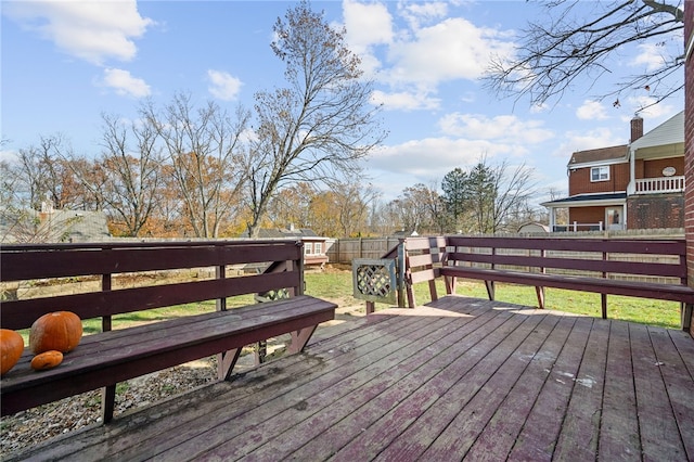 wooden terrace with a lawn