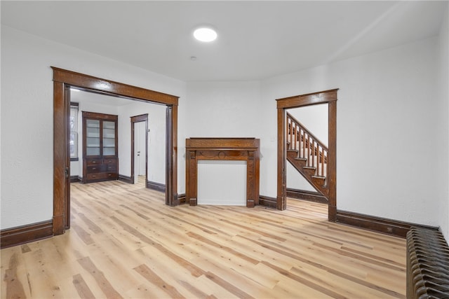 unfurnished room with light hardwood / wood-style floors