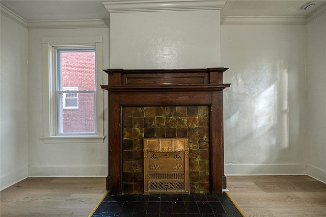 room details featuring hardwood / wood-style floors, a fireplace, and ornamental molding