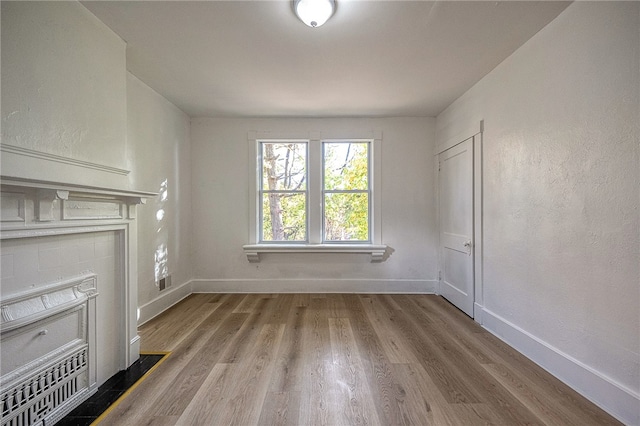 unfurnished living room with light hardwood / wood-style floors